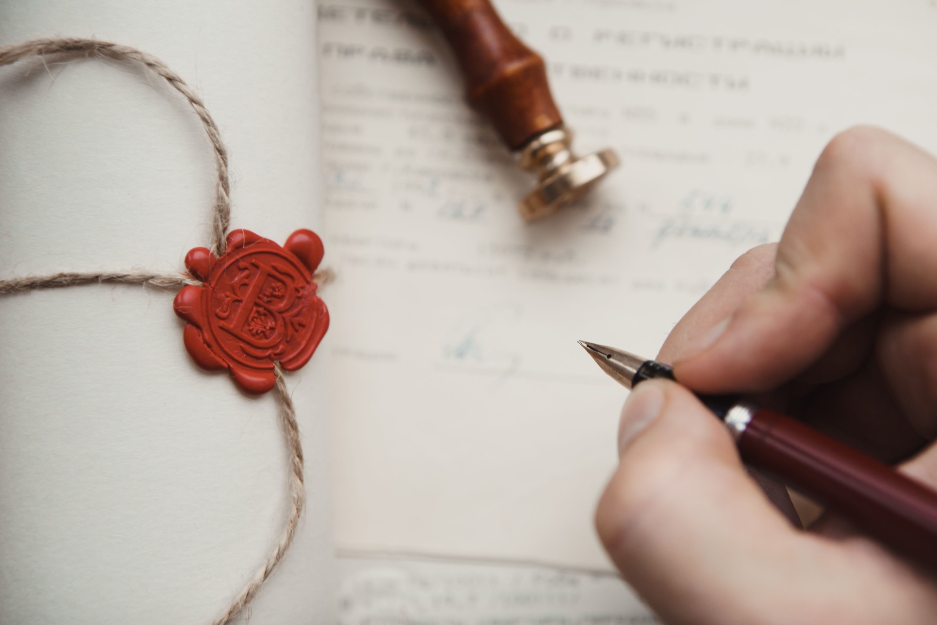 Notary's public pen and stamp on testament and last will.